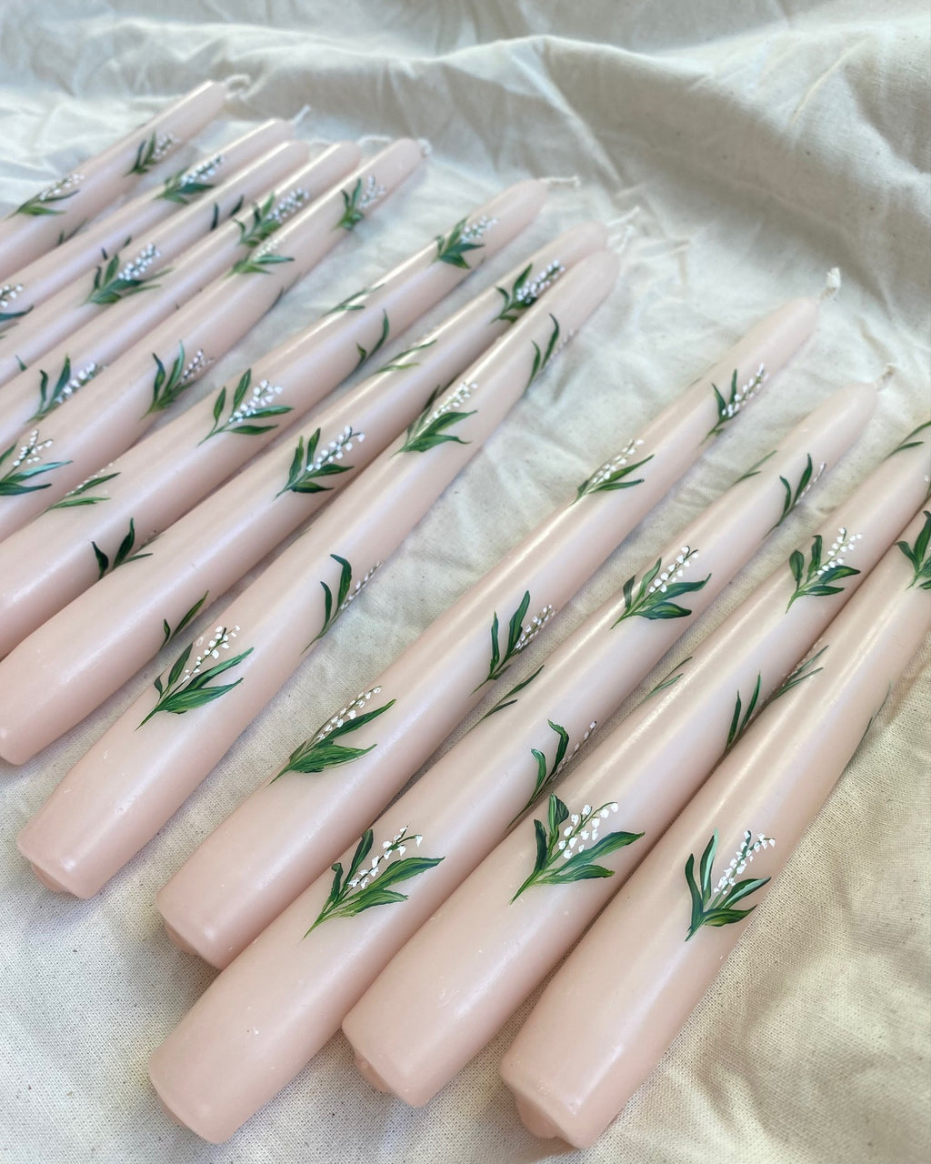 pink hand painted candles with lily of the flowers 