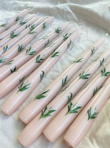 pink hand painted candles with lily of the flowers 