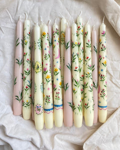 ivory dinner candles with celestial and floral hand painted details.