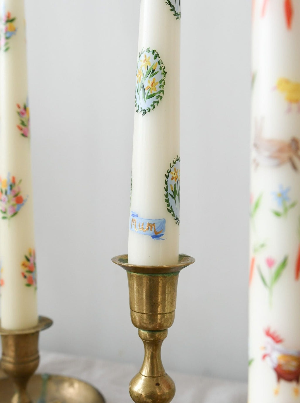 hand painted bespoke mother's day candle with daffodils