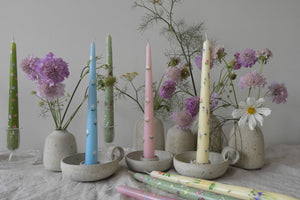 taper dinner candles are in candle holders, creating a pretty table setting idea 